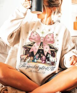 Jesus Christmas Coquette Bow Shirt, Pink Glitter Christian Christmas Sweatshirt, Nativity Scene Shirt, Baby Jesus Shirt, Bible Verse Gift QFHA4091104