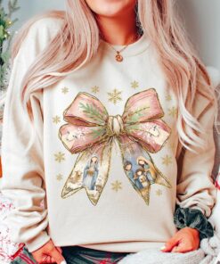 Jesus Christmas Coquette Bow Shirt, Pink Glitter Christian Christmas Sweatshirt, Nativity Scene Shirt, Baby Jesus Shirt, Bible Verse Gift QFHA4091102